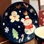 Piatto in ceramica dipinto a mano raffigurante un pupazzo di neve natalizio